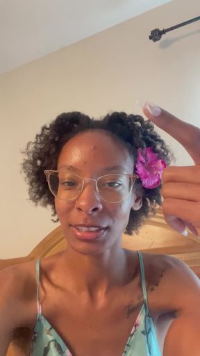 Woman with curly hair and glasses