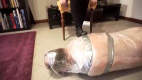 Two naughty chicks punishing their slave in tape bondage