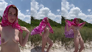 Naked MILF on a nudist beach shows off her small tits
