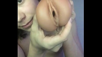 Jessica masturbates on her bed with a lubed up fleshlight
