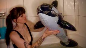 Empress has a bubble bath with her new baby Orca