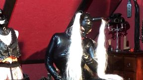 dominatrix frida in latex catsuit