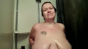 Jen is playing with her own tits in the shower