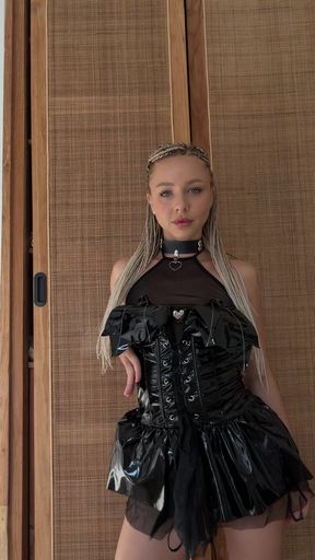 Blonde latex babe shows off her petite figure