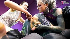 Inked submissive fellow double-pegged into submission by two without mercy dominatrixes