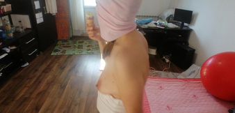 Amateur wife dancing naked at home. Amateur woman has fun trying on clothes and cutting them.