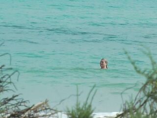 Watching on the beach as Isa has enjoyment