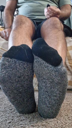 Taking off my socks and rubbing my soft bare feet and soles all over your face and tool