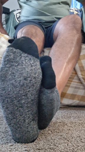 Taking off my socks and rubbing my soft bare feet and soles all over your face and tool