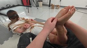 xy353 - A cute barefoot girl is bound by ropes and has her feet tickled.