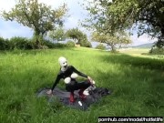 Rubber Girl Full in Black Latex Catsuit and Mask Plays with herself Outdoor in a Meadow - Part 3