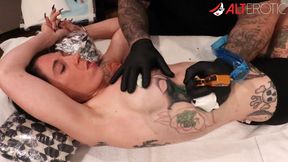 Marie Bossette gets a rose tattooed on her rib