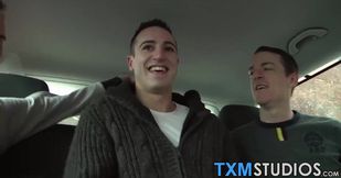 Horny and attractive studs have hot threesome sex in a car