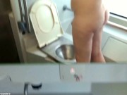ACD01 Clip: Pissing naked in public train bathroom.