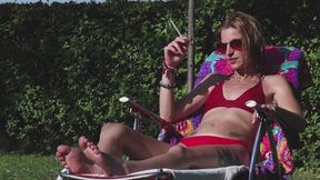 Eve sensually smoking 120's while sunbathing in slow motion 1