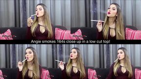 Angie smokes 164s close up in a low cut top!