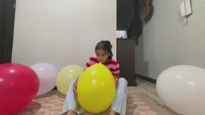 Akina blows Balloons on the floor