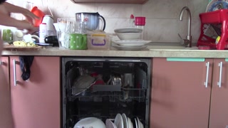 Sexy Latina naked in the kitchen. Naked sexy woman prepares food in the kitchen. Amateur woman pu