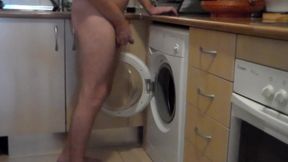 John is peeing all into the washing machine