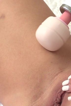 Hot brunette babe uses a big wand