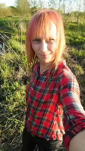 Swimming in jeans and shirt in river.