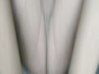 Nylonjunge in hose in front of TV