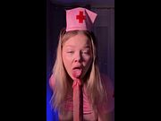 Nurse hat perched as she licks her finger slow