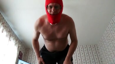 Masked muscular man in red balaclava jerks off on camera