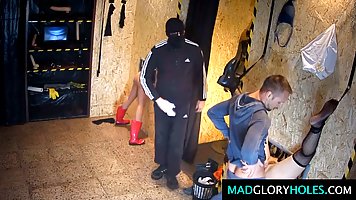 Frisky teen is spreading her legs wide open for random strangers through a gloryhole in the club