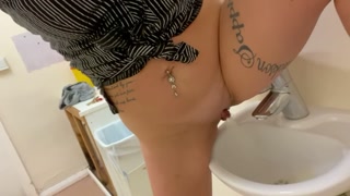 Pissing in public toilet sink
