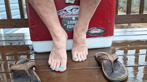 Bare male feet with flip flops and pedicured toes