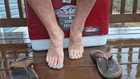 Bare male feet with flip flops and pedicured toes
