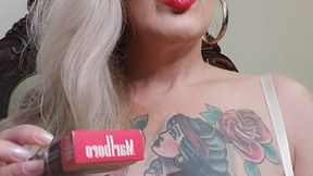 Blonde milf, red mouth, wearing a very sexy transparent bra, while inhaling and exhaling her red Marlboro