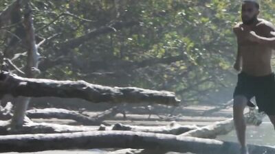 Running man finds cute redhead on the beach