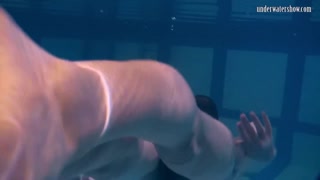 Babes swim strip and have fun underwater