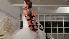 Bondage of Sofi with leather garters and bracers in a wedding dress_ Tel