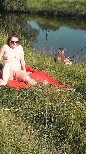 Iconic moment from &quot;Wild beach. Sexy MILF Platinum naked sunbathing on river bank, random fisherman guy watches. Naked in&quot;