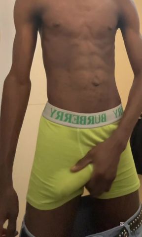 Sexy teen with abs stroking his big black cock in public