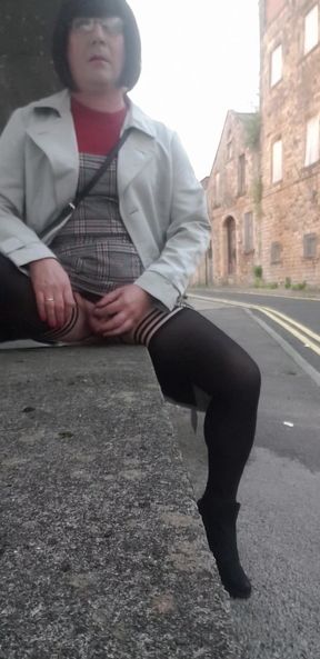 Stunning moment from &quot;Crossdressing slut exposes her caged cock on public street&quot;