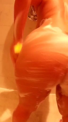 Miss Raquel Soaps and Spreads Pussy with Big Dildo