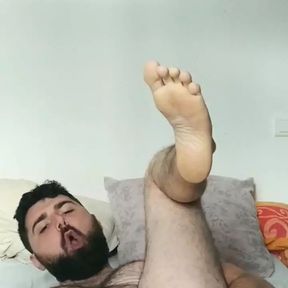 Hairy guy fingering his asshole