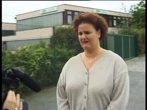Outdoors interview with mature brunette