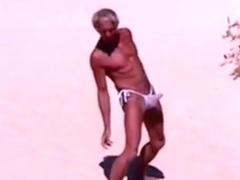 Tanned guy on beach in tiny string thong (temporarily!)