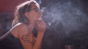 Chloe Toy chain smoking corks while laying down