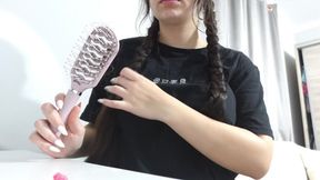 My stepsister combs her hair and does her makeup