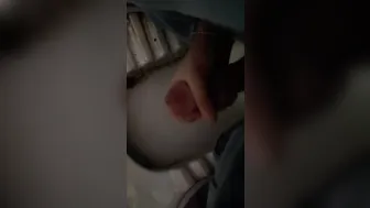 Twink jerks big cock in public toilet with people nearby