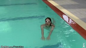 Amazing t-girl poses in bikini poolside and strips in shower