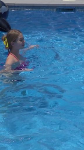 Lesbian Girls Are Having Fun in a Pool with an Inflatable Shark