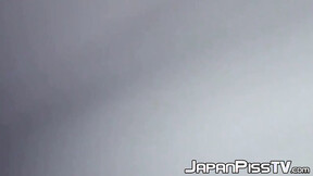 ”Delectable Japanese beauty is peeing outside during day time”