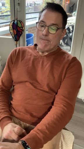 Jerking off and cumming in my orange sweater